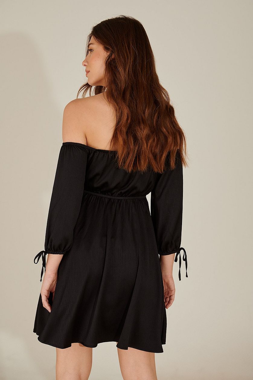 Stylish Black Fit and Flare Dress with Solid Three-Quarter Sleeves