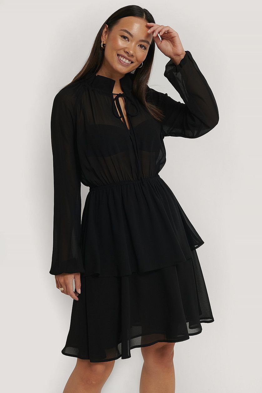 Chic Black Georgette Dress with Balloon Sleeves & Sheer Cut Out Design