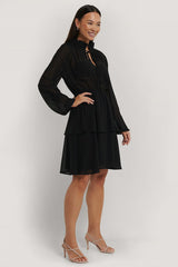 Chic Black Georgette Dress with Balloon Sleeves & Sheer Cut Out Design