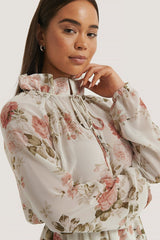 Elegant White Chiffon Fit and Flare Dress with Long Sleeves and Floral Print