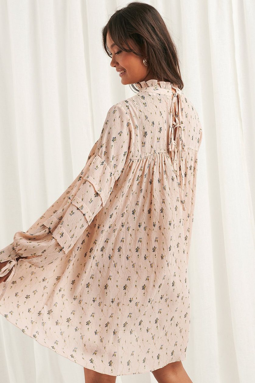 Chic Peach Fit and Flare Georgette Dress with Printed Balloon Sleeves - Shop Now