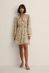 Chic Beige Fit and Flare Georgette Dress with Printed Puff Sleeves - Shop Now