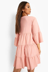 Stylish Pink Tiered Rayon Dress with Bell Sleeves and V Neck - Perfect for Any Occasion