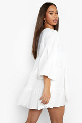 Elegant White Rayon V Neck Dress with Bell Sleeves - Tiered Solid Design