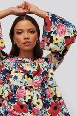 Chic Multi Flounce Georgette Floral Print Dress with Bell Sleeves - Shop Now