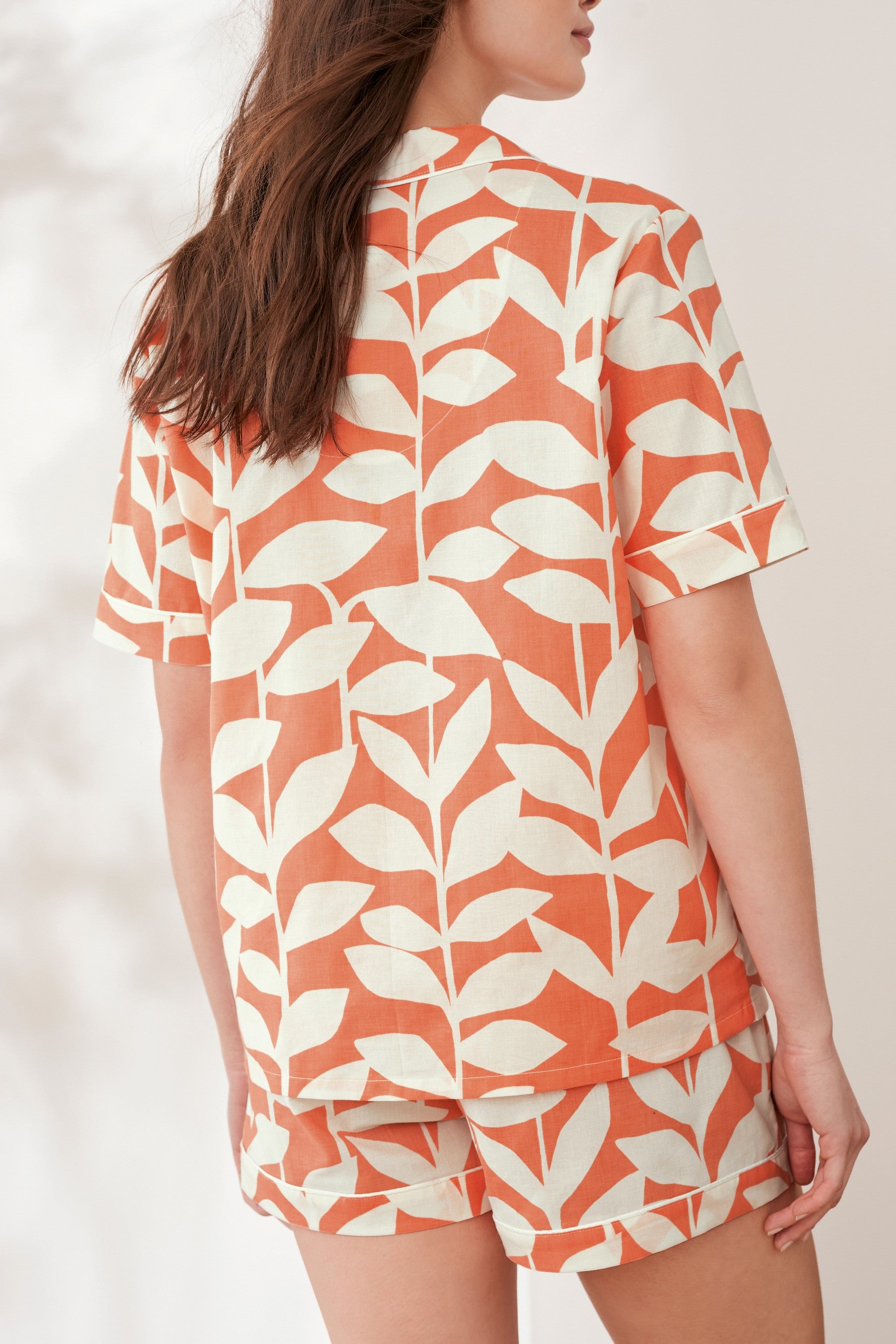 Styleinstant Orange Leaves Printed Lounge Wear.